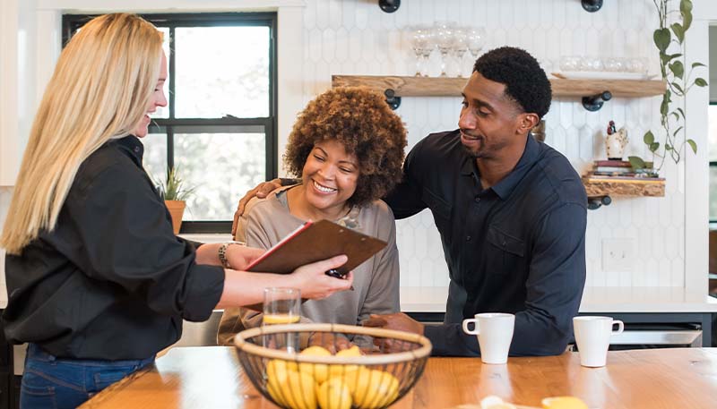 discussing hvac installation checklist at kitchen table