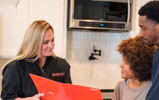 sales women with couple in kitchen