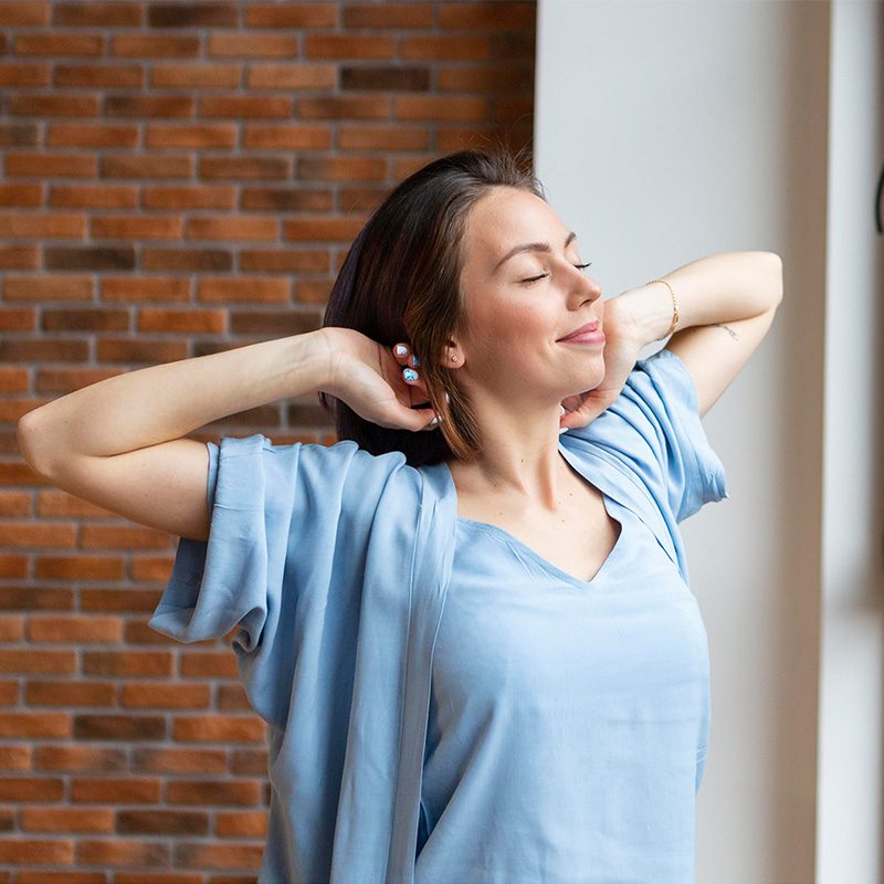 woman breathing in clean air smiling